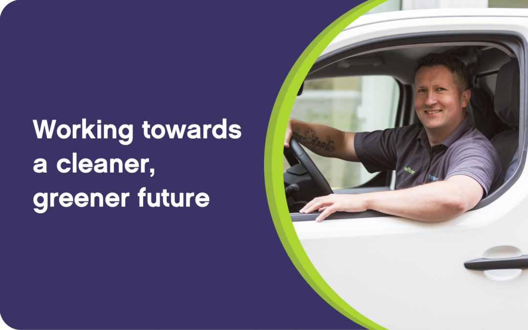 Blog header image with text 'Working towards a cleaner, greener future' and image of delivery driver sitting in van and looking at the camera smiling